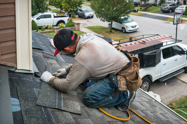 Professional Storm Damage Roof Repair technician working in Gambier, OH